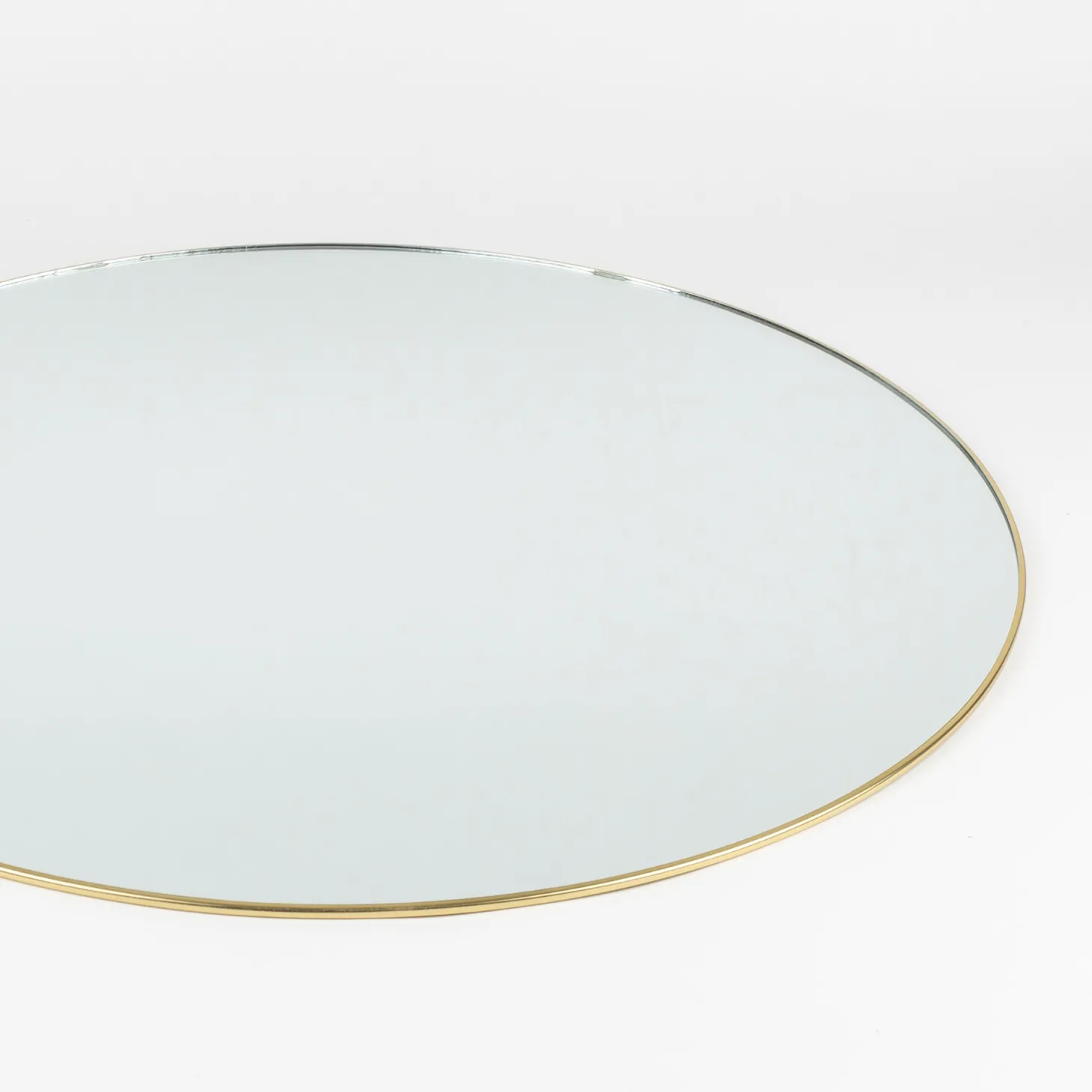Espejo de pared redondo de metal dorado Orión Ø55cm